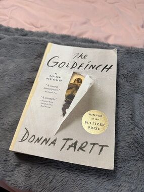 The Goldfinch by Donna Tartt - Paperback Novel (cream, gold)